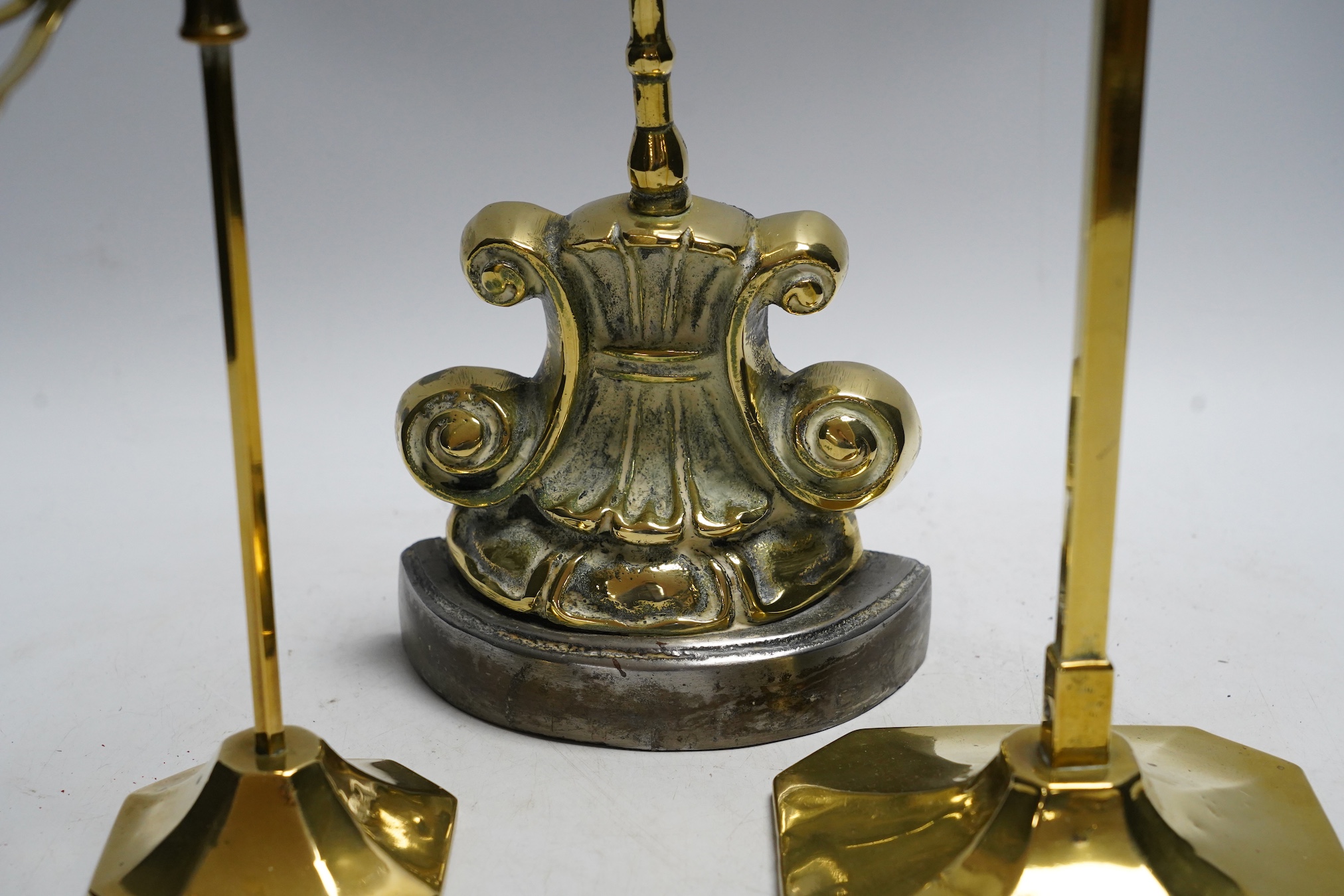 A Victorian brass door porter and two brass stands, tallest stand 45cm high